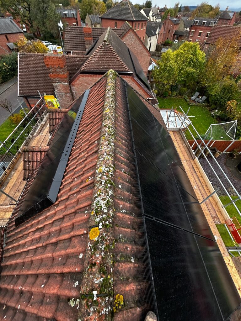 Aiko 470W on roof panels with bird mesh and solaskirt